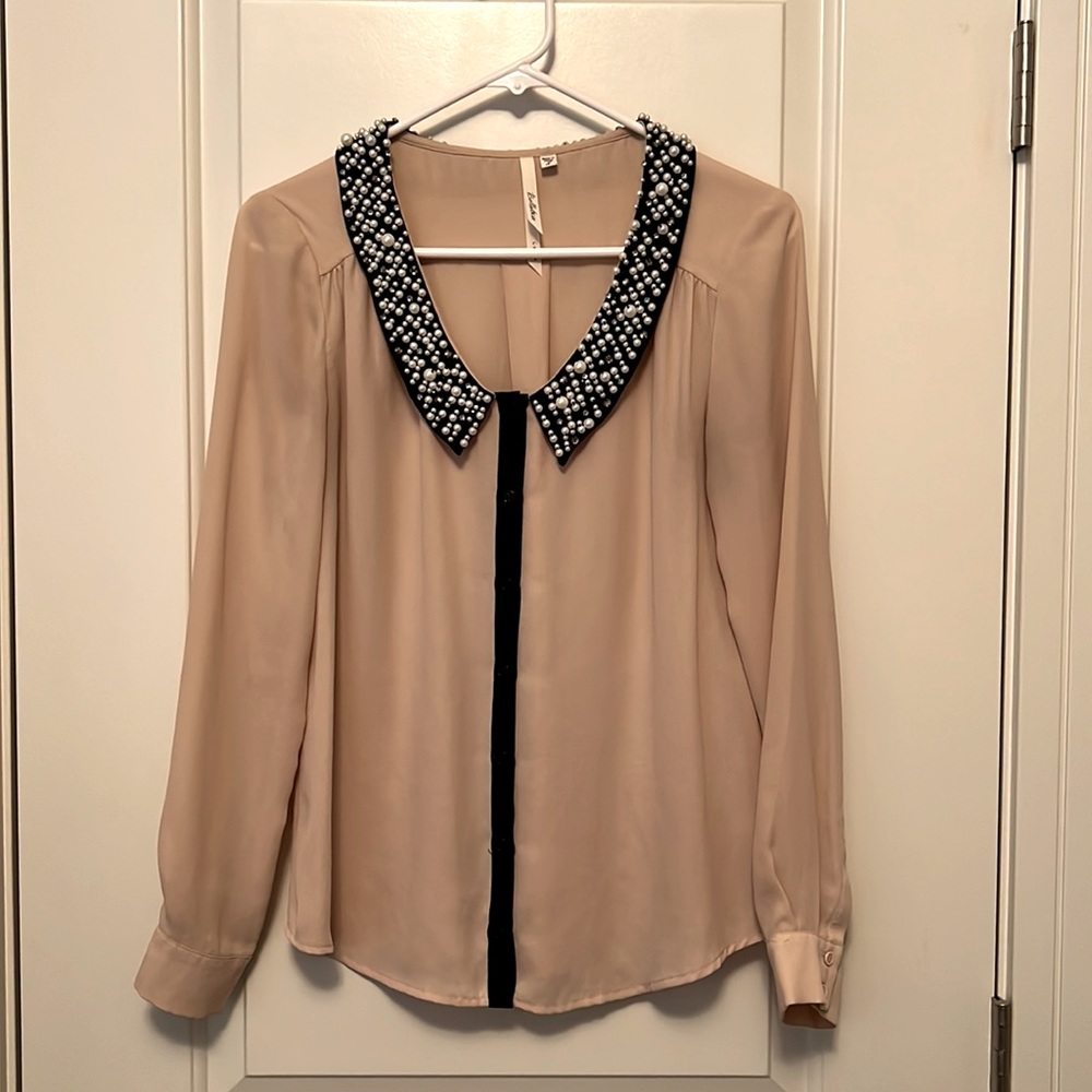 Pale pink button up with pearl and crystal embellishment.